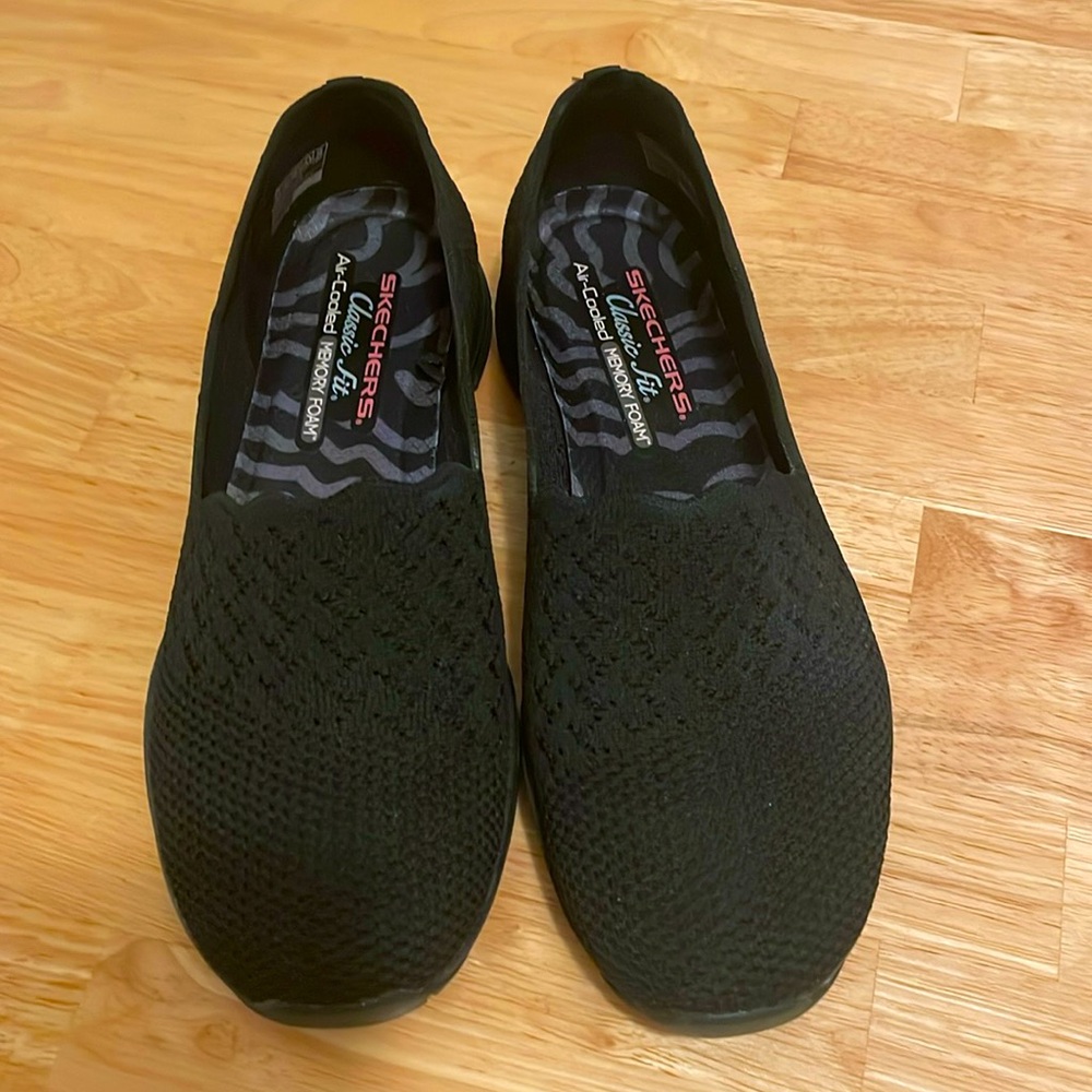 Black Skechers Classic Fit slip on mesh flats. Like new; Worn twice.